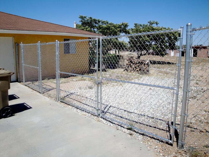 Photo of double swing gate showing all chain-link fence components