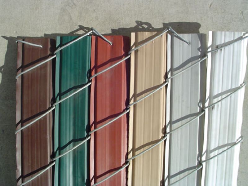 Decorative panels for a privacy chain link fence