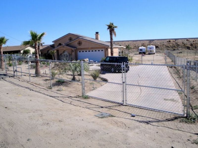 Double-swing front yard gate at a High Desert home
