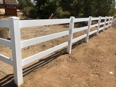 ranche style white vinyl fence with mesh