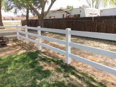 white ranch-style fence on a property