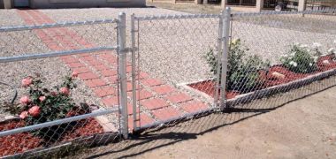 new chain link fence in front of a house) (suggested file title: new-fence
