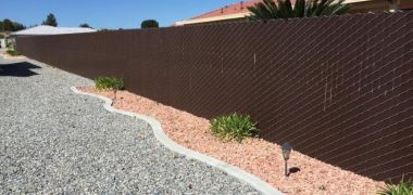 dark brown fencing in the high desert