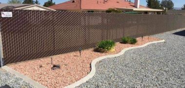 chain link privacy fence around a California home