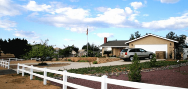 house with a newly installed ranch style fence