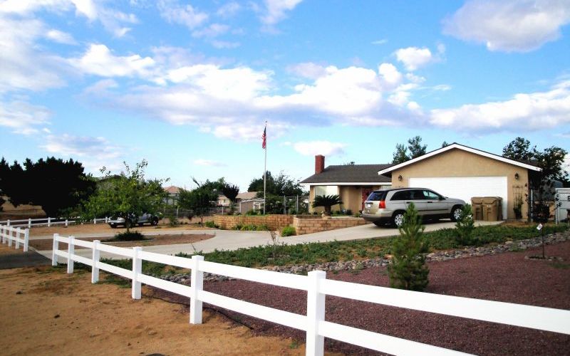 Two-rail ranch rail fence around Phelan home
