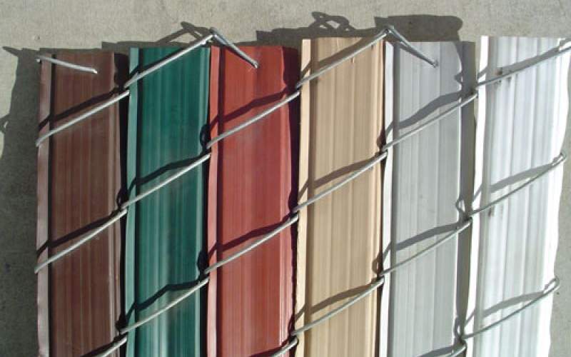 Decorative panels for a privacy chain link fence