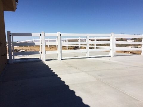 white vinyl ranch style fence